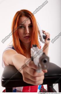 13 2018 01 TINA KNEELING POSE WITH GUNS